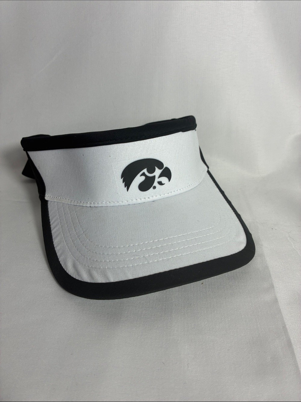 Iowa Hawkeyes NCAA White and Black Visor with Hawkeye Logo.